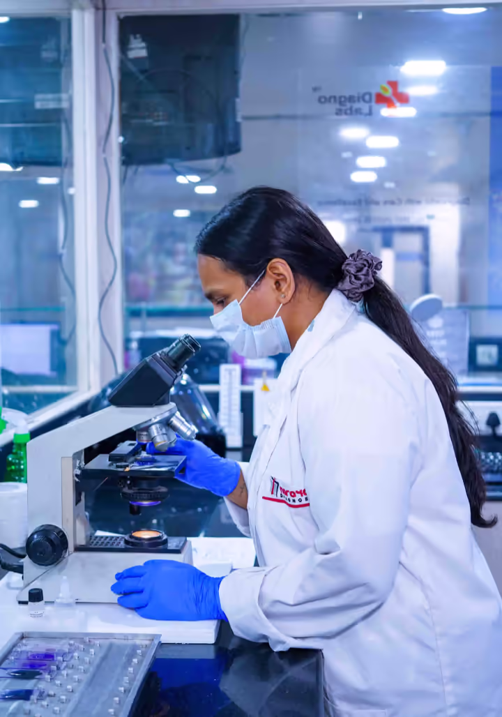 Pathologist examining a sample at Diagnos Lab, Jamshedpur